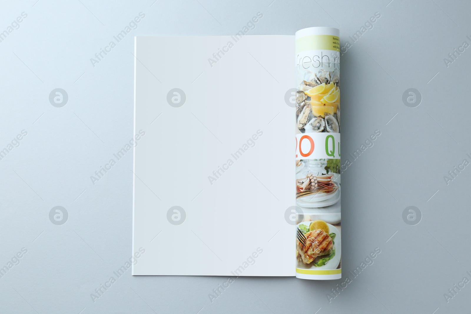 Photo of Open magazine on grey background, top view. Mockup for design