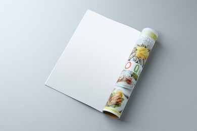 Photo of Open magazine on grey background. Mockup for design