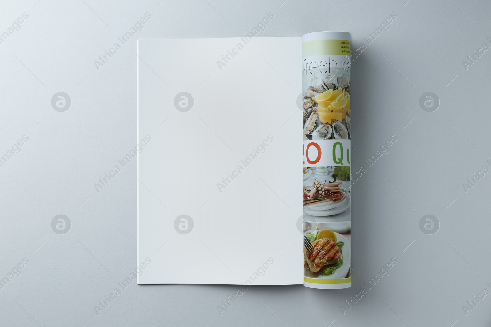 Photo of Open magazine on grey background, top view. Mockup for design