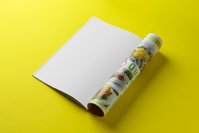 Open magazine on yellow background. Mockup for design