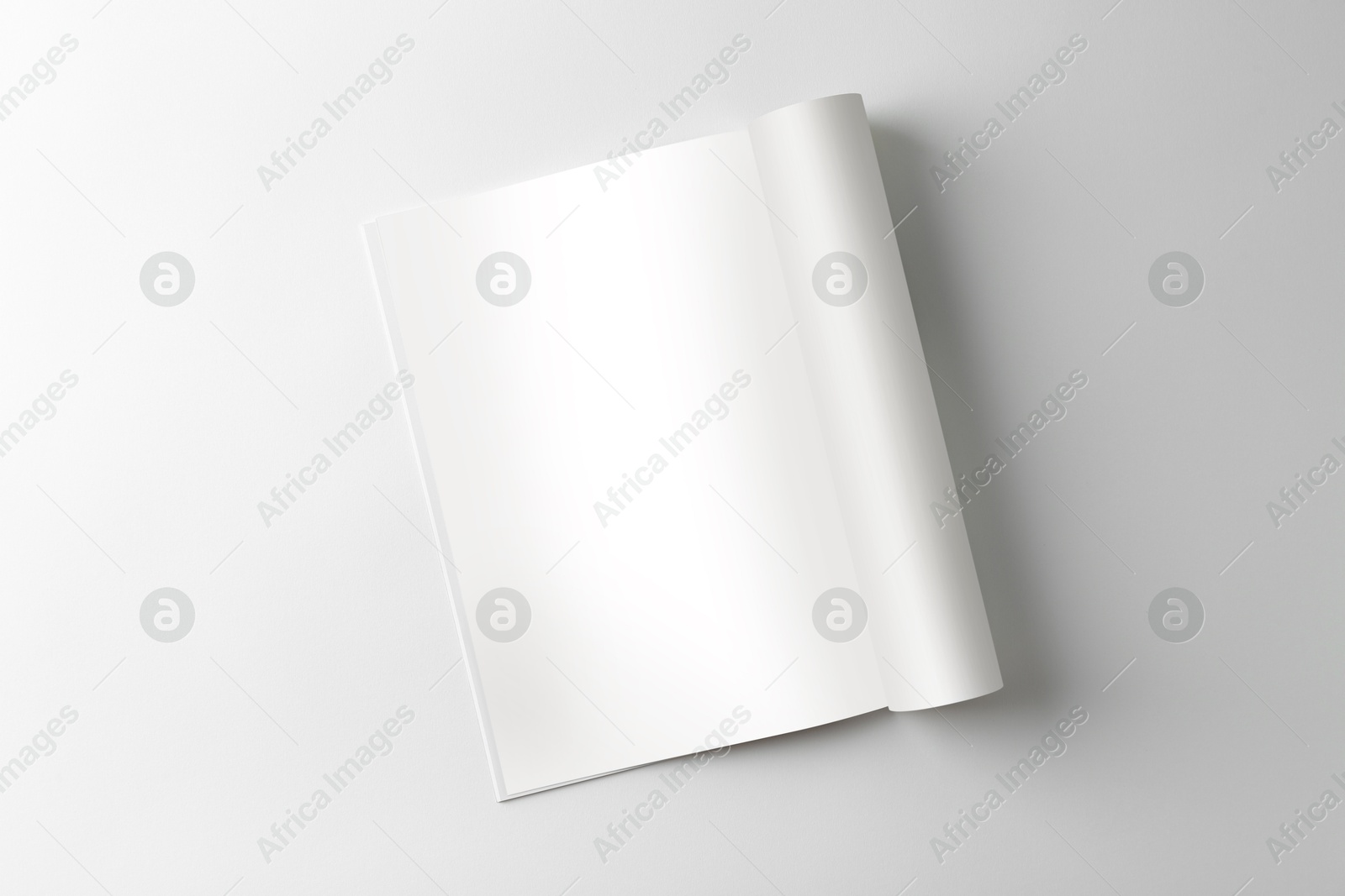 Photo of Open magazine on white background, top view. Mockup for design