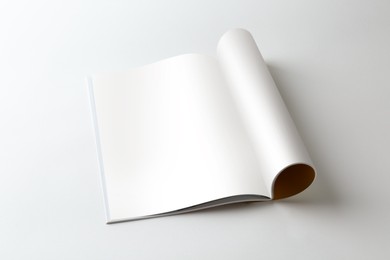 Photo of Open magazine on white background. Mockup for design