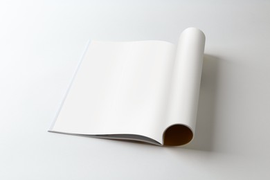 Photo of Open magazine on white background. Mockup for design