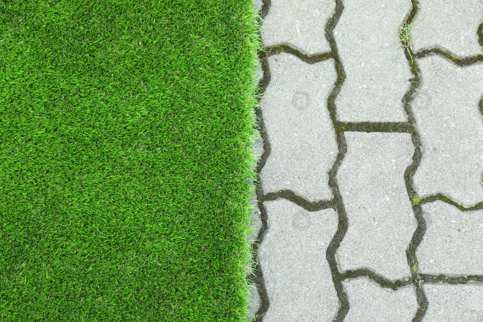 Photo of Sheet of artificial turf outdoors, top view