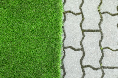 Sheet of artificial turf outdoors, top view