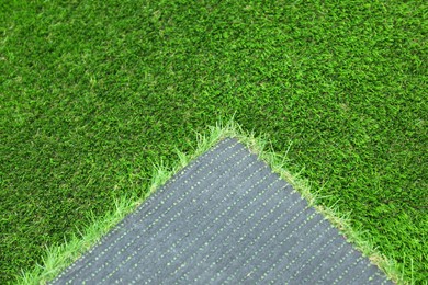 Sheet of artificial turf as background, closeup