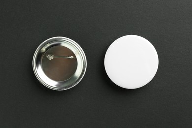 Photo of Button badges on black background, flat lay. Mockup for design