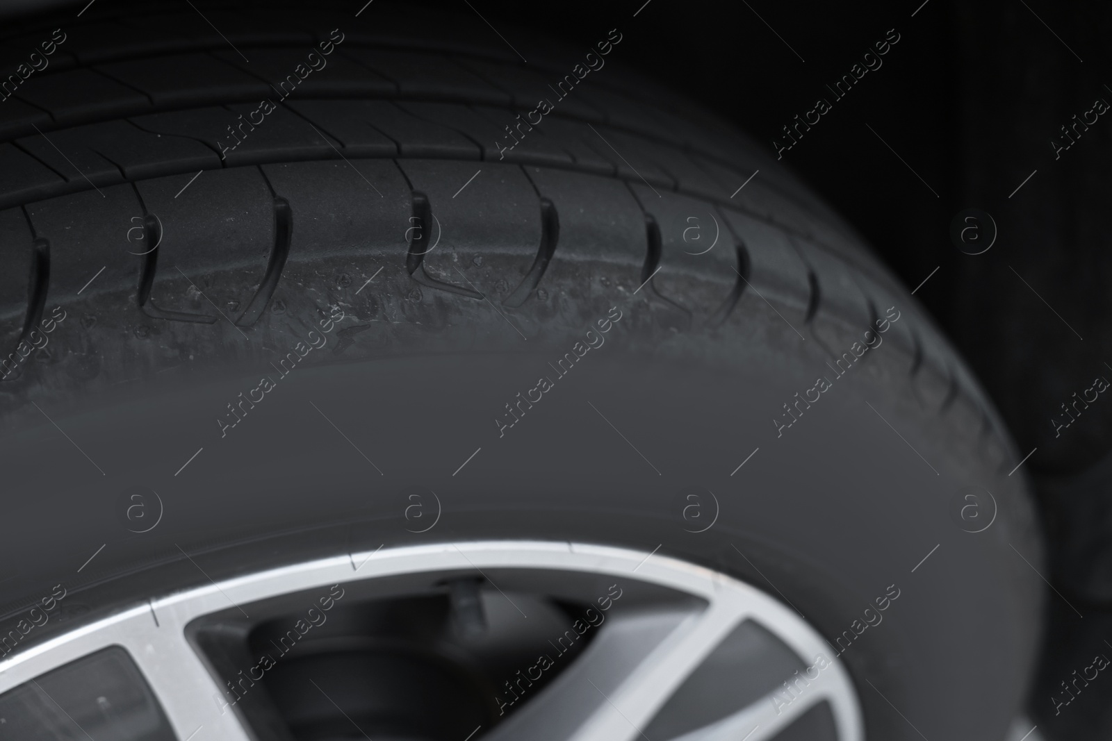 Photo of Modern car with big wheel, closeup view