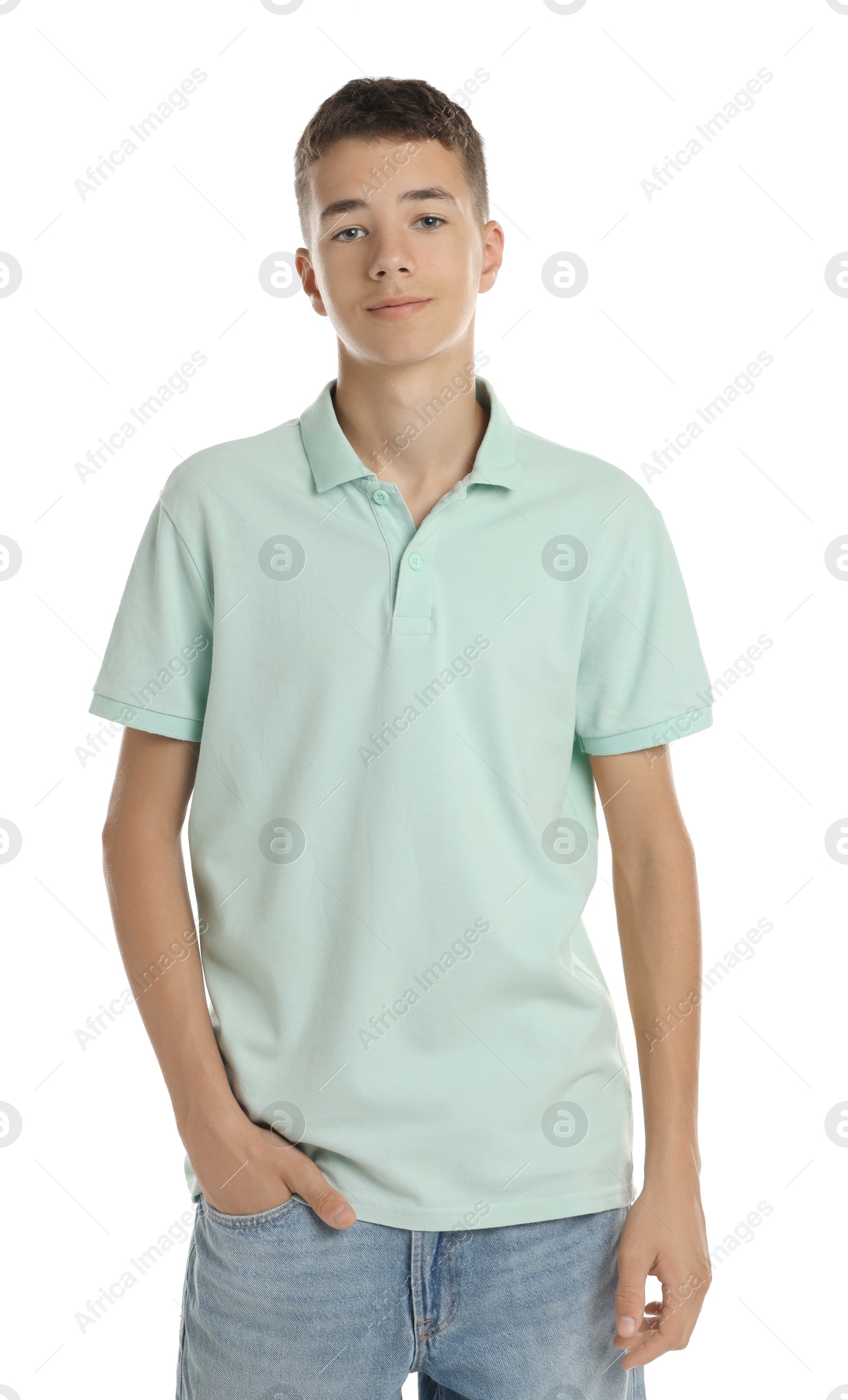 Photo of Teenage boy wearing light green t-shirt on white background