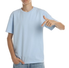 Photo of Teenage boy wearing light blue t-shirt on white background, closeup