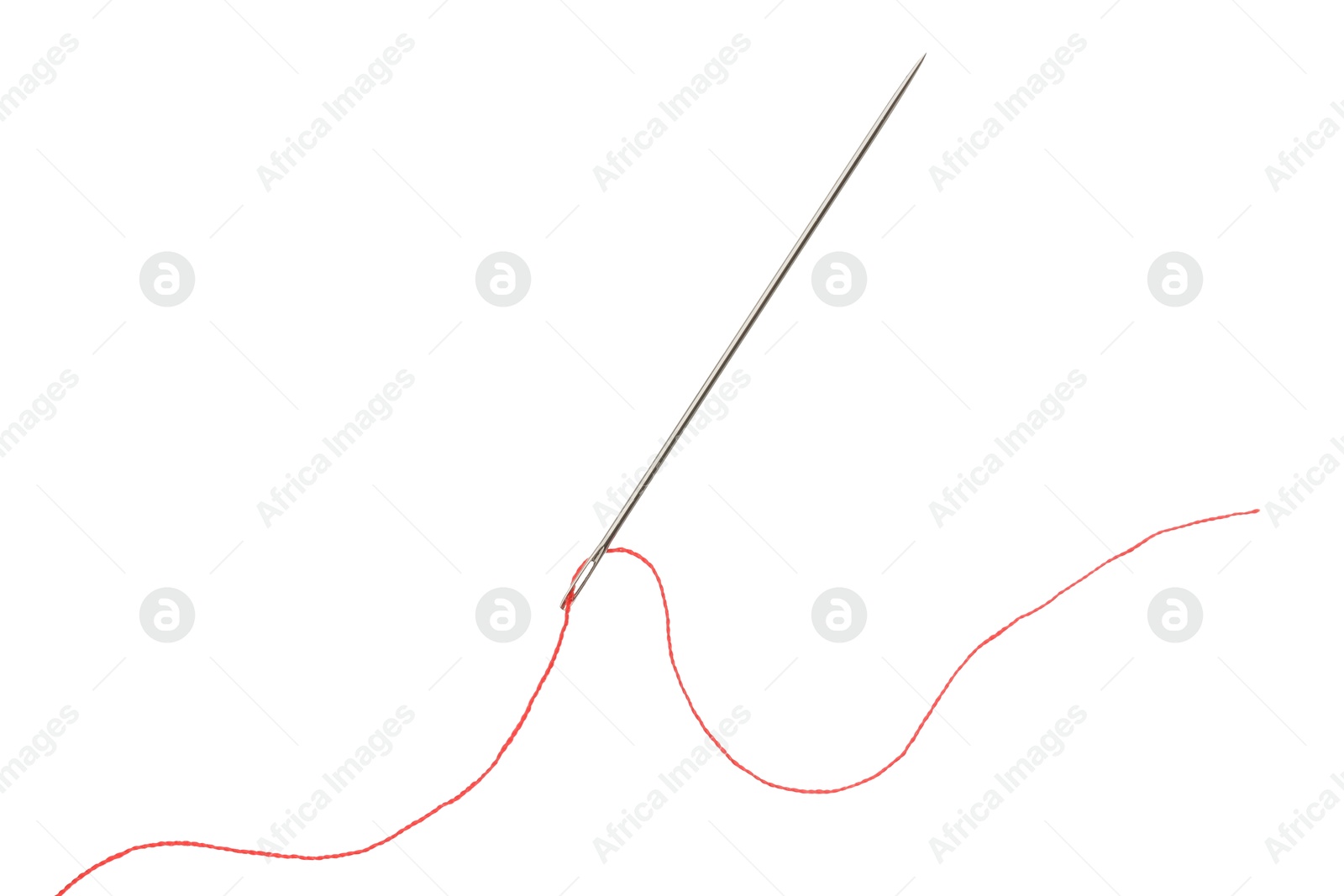 Photo of Sewing needle with red thread isolated on white