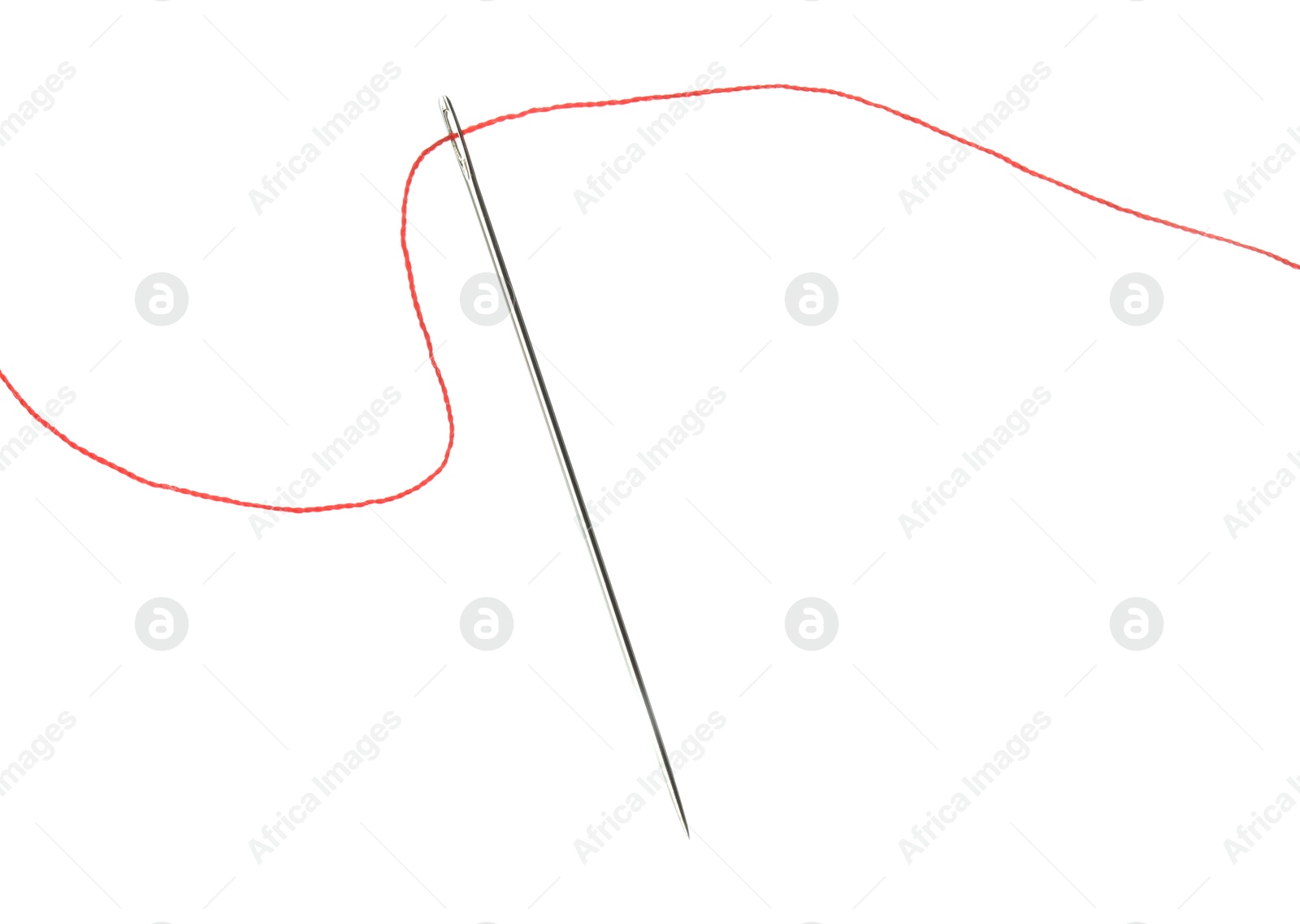 Photo of Sewing needle with red thread isolated on white