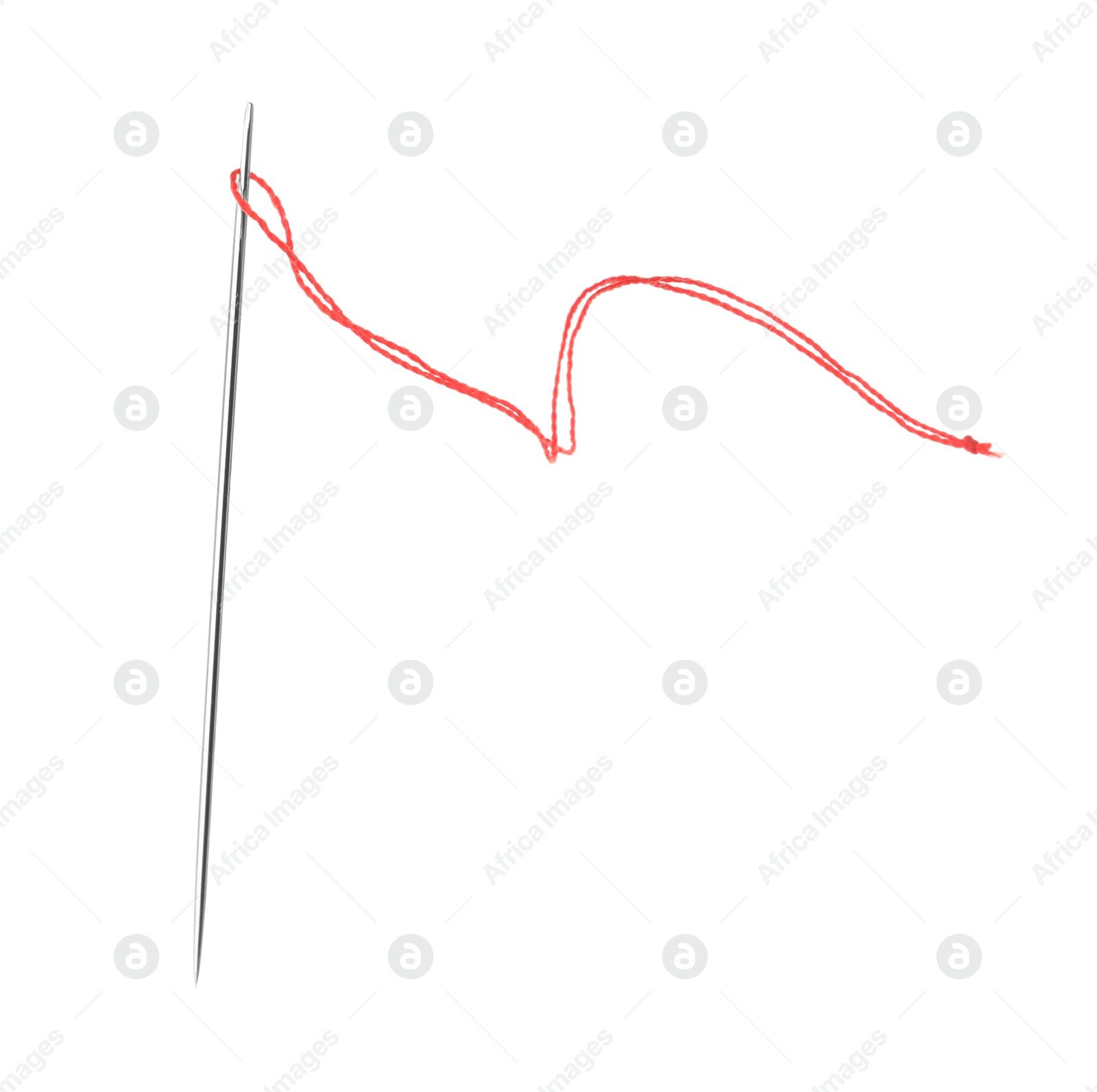 Photo of Sewing needle with red thread isolated on white