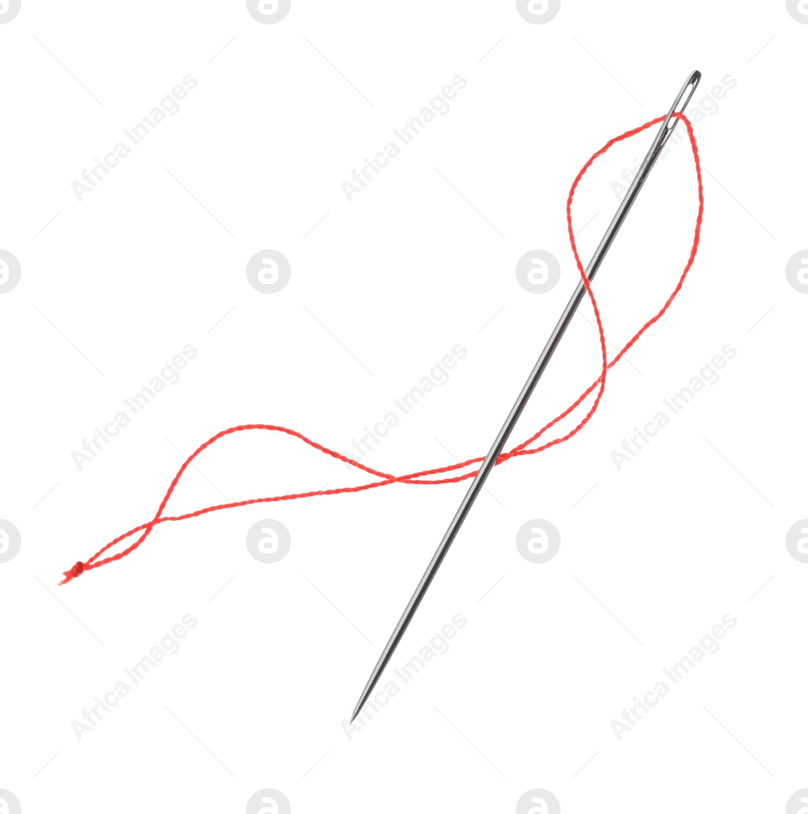 Photo of Sewing needle with red thread isolated on white