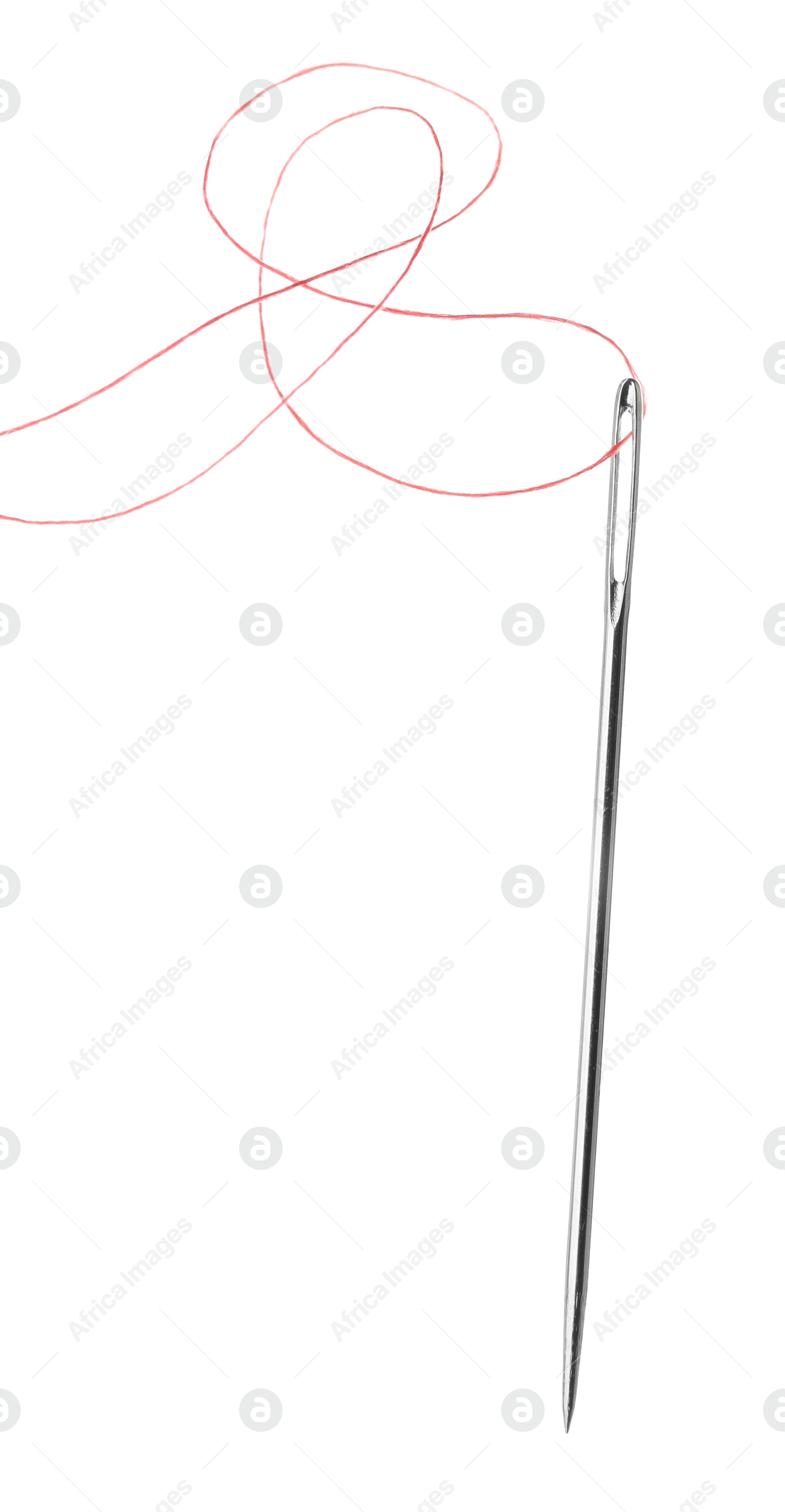 Photo of Sewing needle with red thread isolated on white