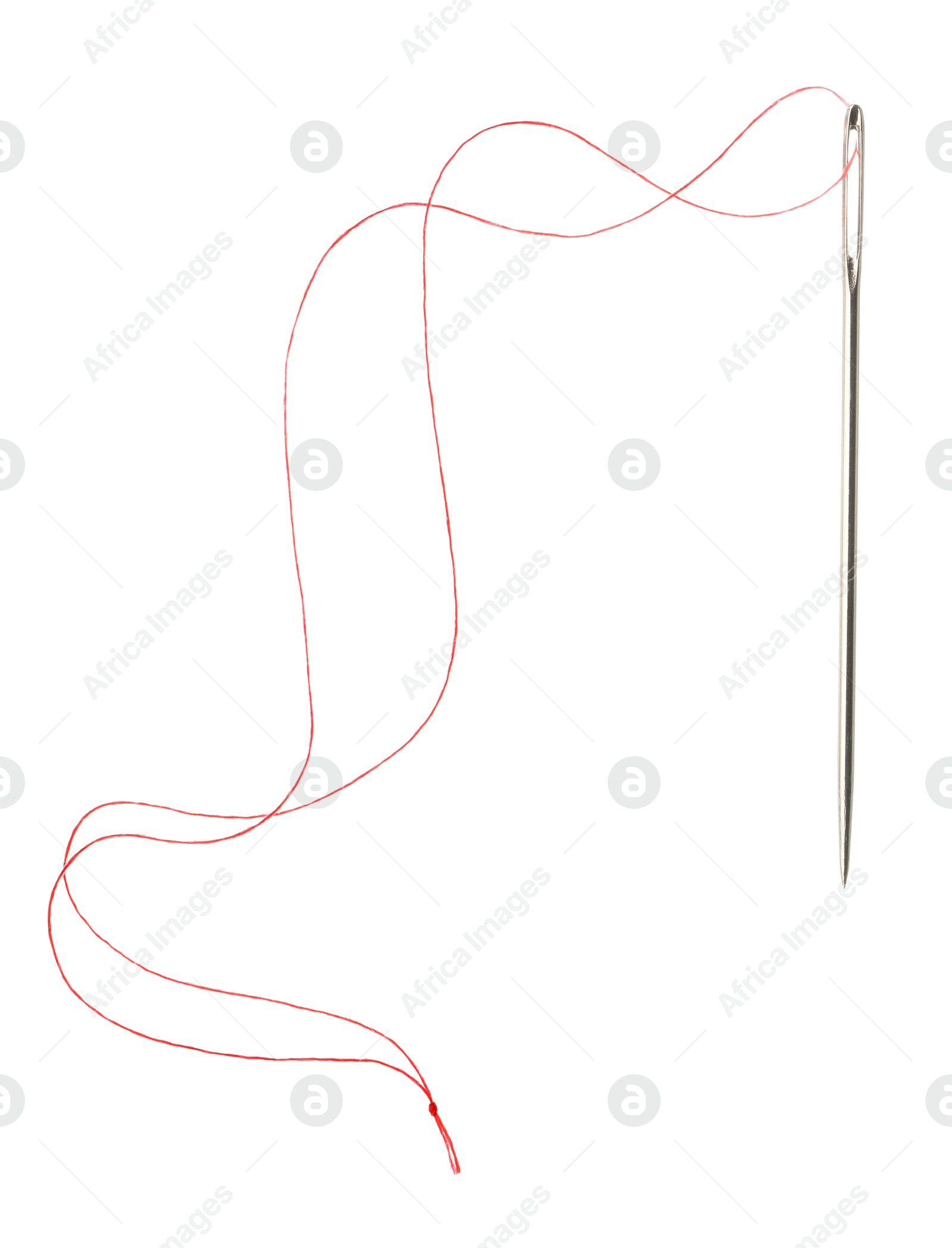 Photo of Sewing needle with red thread isolated on white