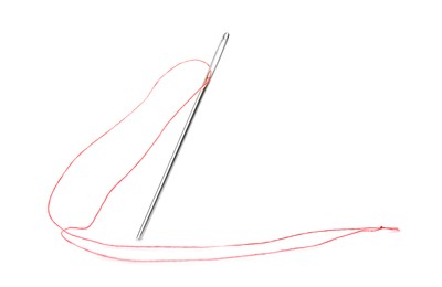 Photo of Sewing needle with red thread isolated on white