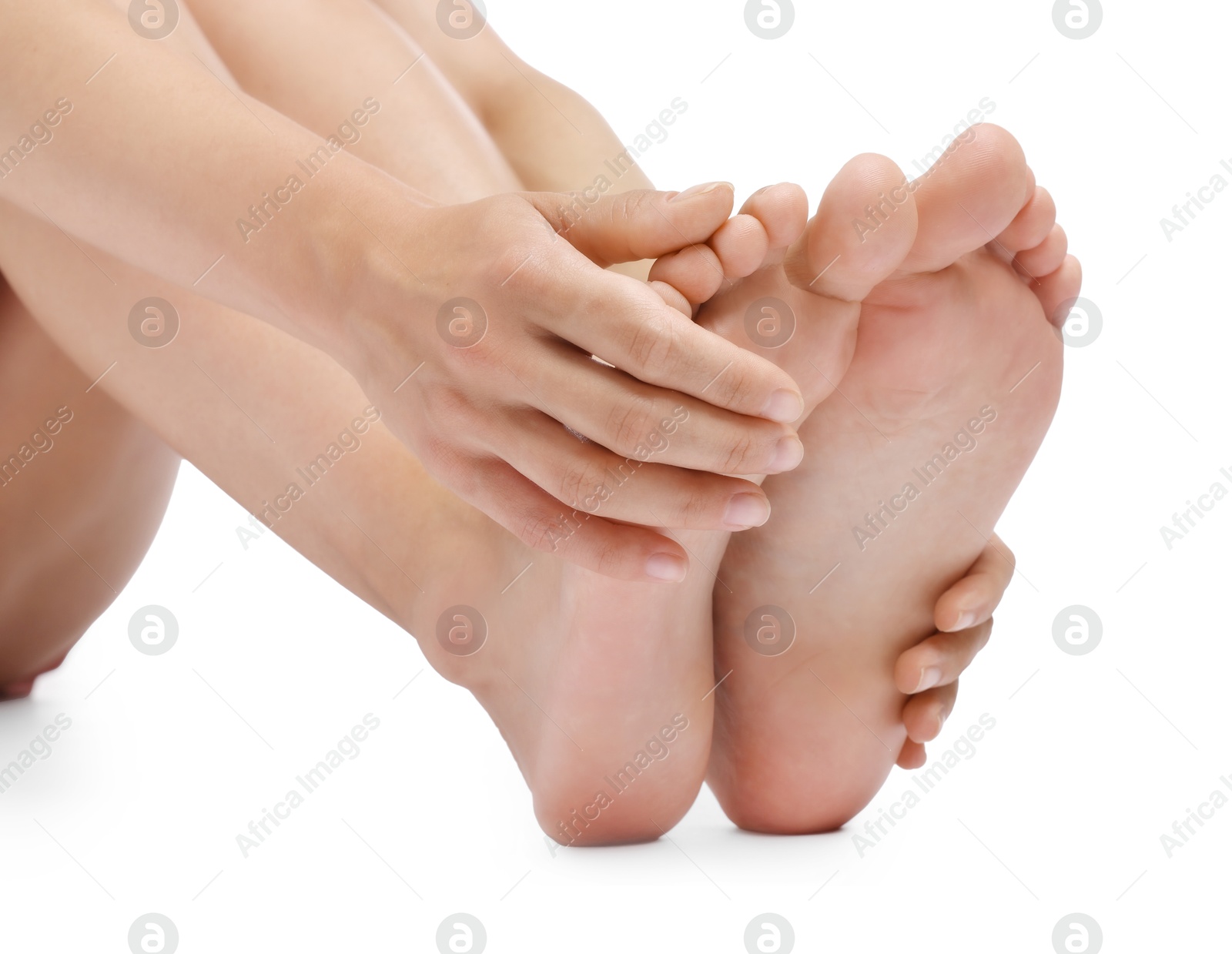 Photo of Woman touching her smooth feet on white background, closeup