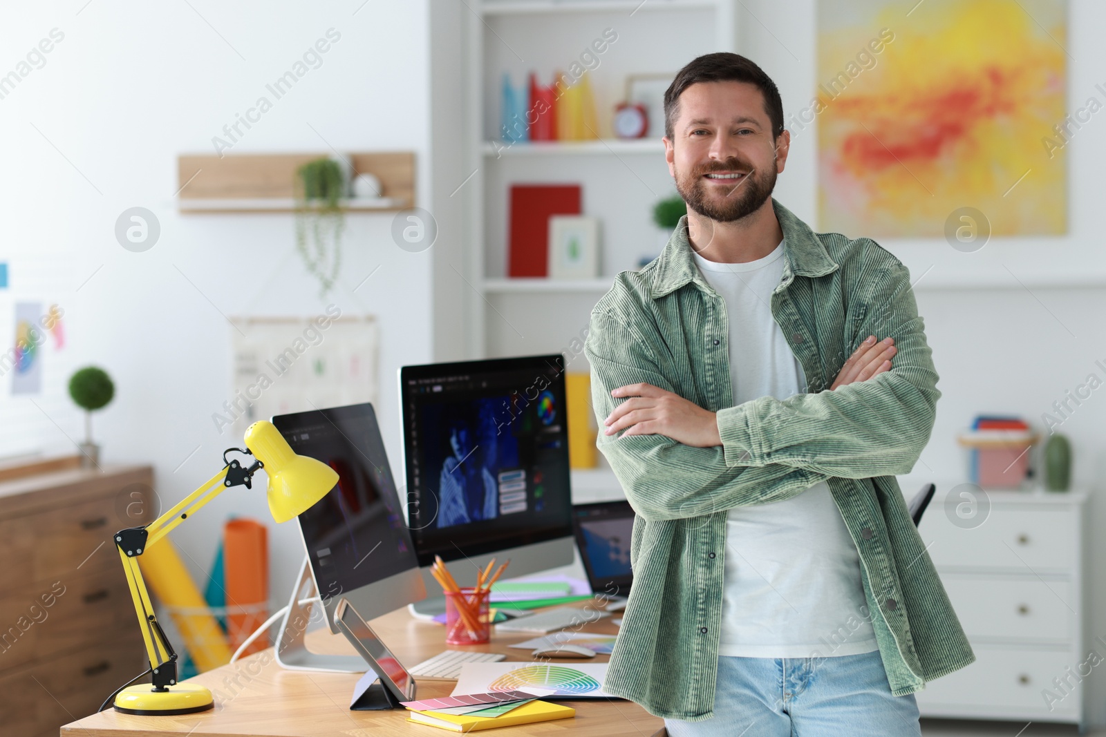 Photo of Portrait of smiling designer in modern office