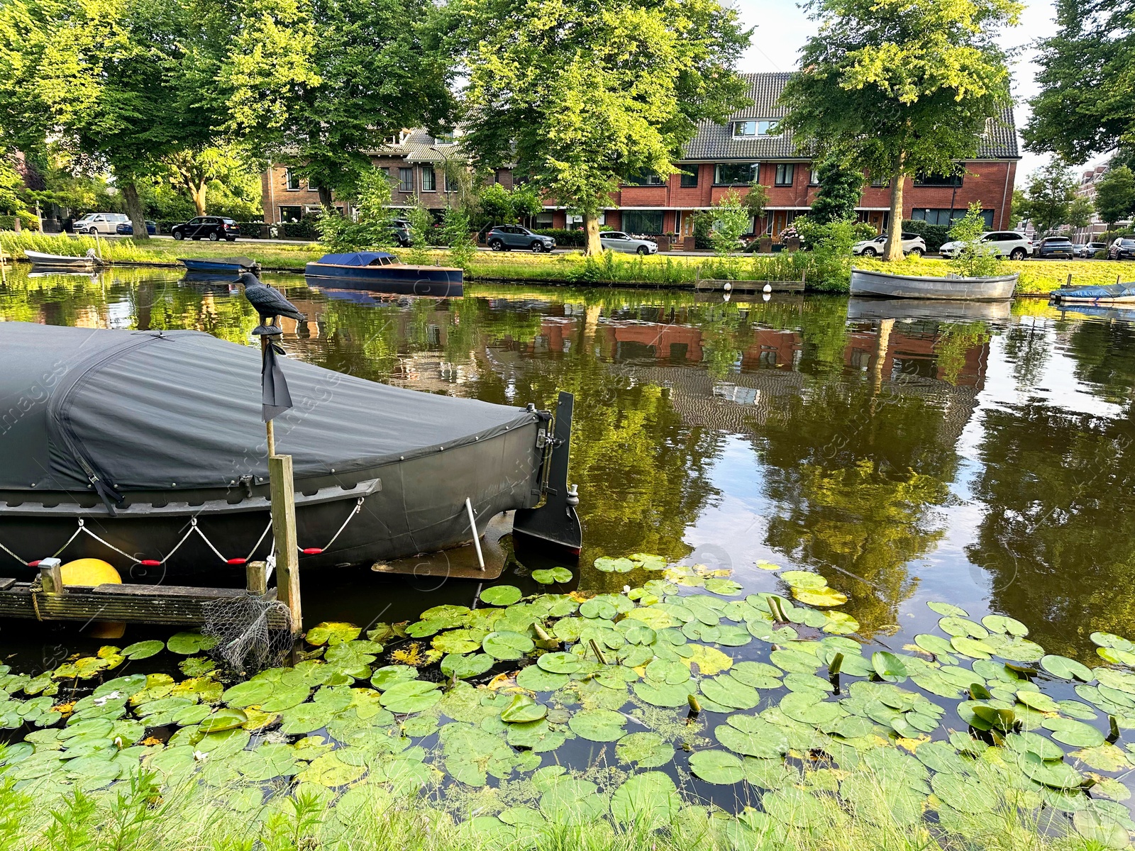 Photo of Picturesque view of canal with moored boats