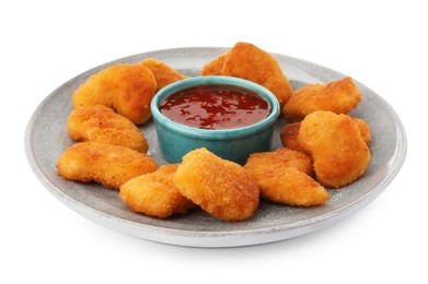 Photo of Plate with hot chili sauce and nuggets isolated on white