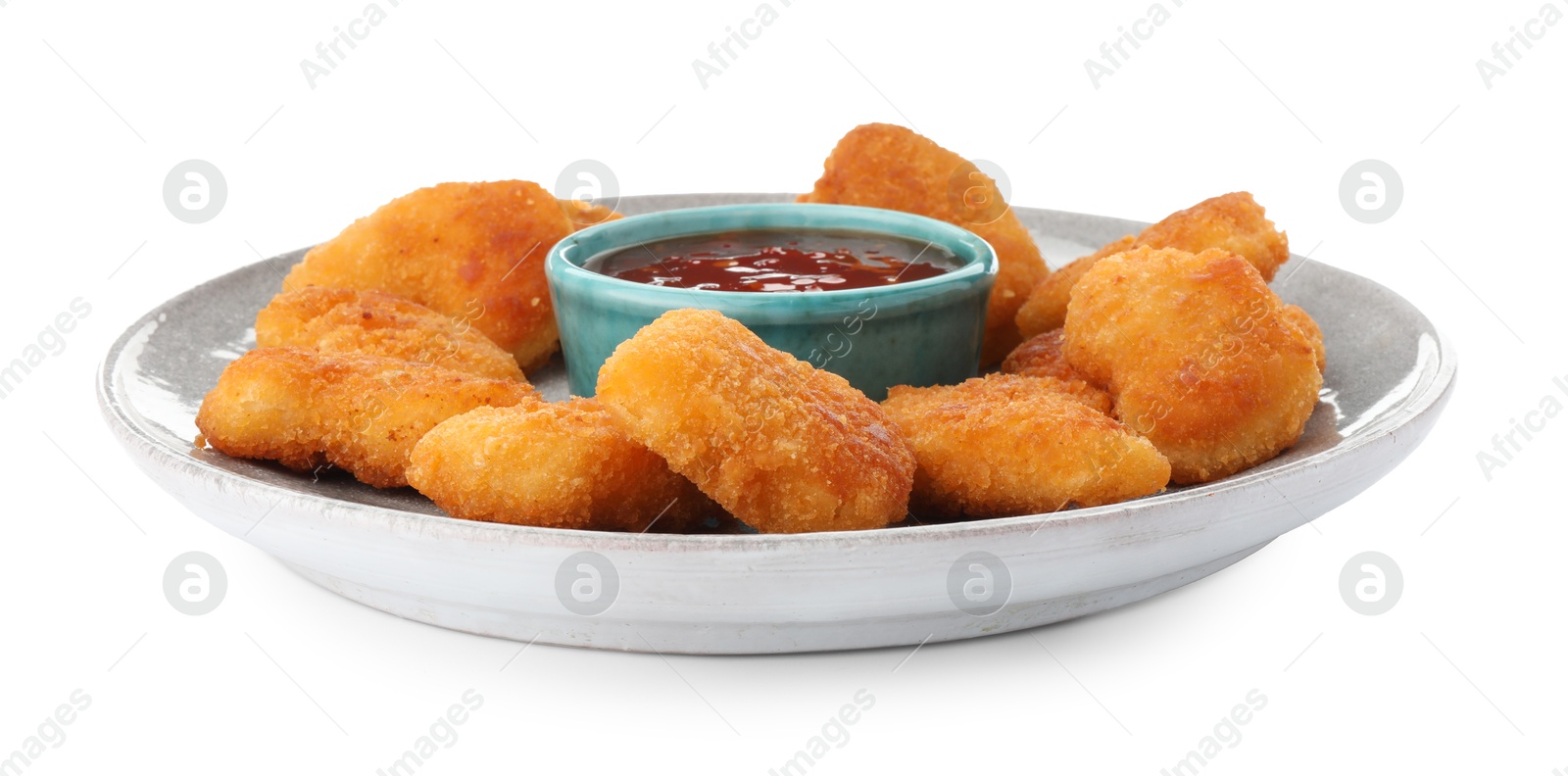 Photo of Plate with hot chili sauce and nuggets isolated on white