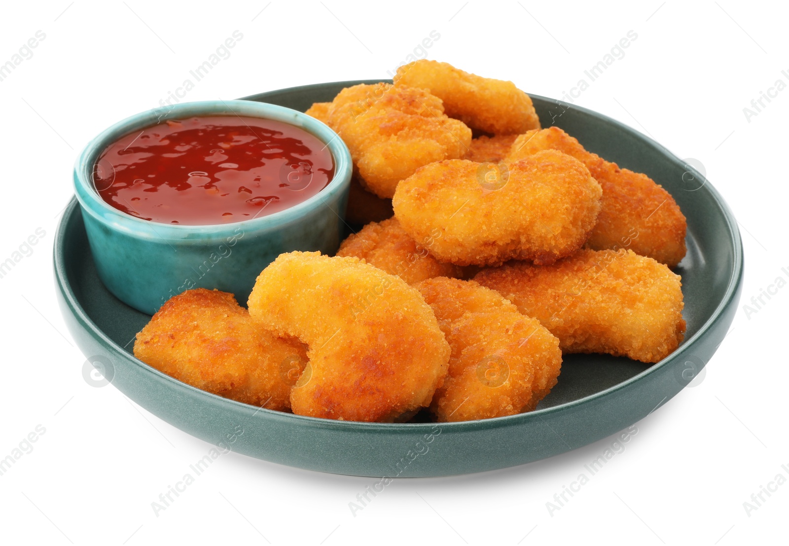 Photo of Plate with hot chili sauce and nuggets isolated on white