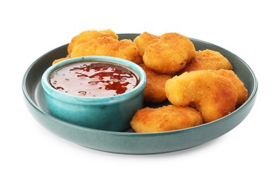 Photo of Plate with hot chili sauce and nuggets isolated on white