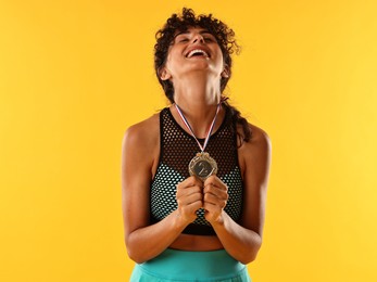 Happy winner with silver medal on yellow background