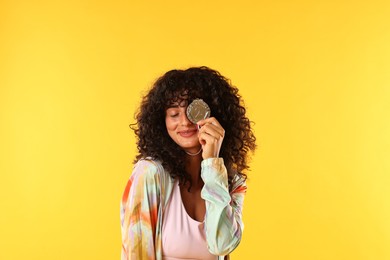 Happy winner with silver medal on yellow background