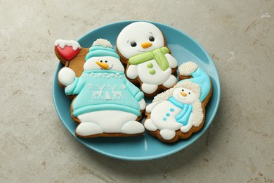 Photo of Delicious cookies in shape of snowmen on light grey table