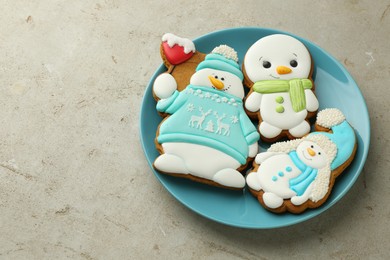 Photo of Delicious cookies in shape of snowmen on light grey table. Space for text