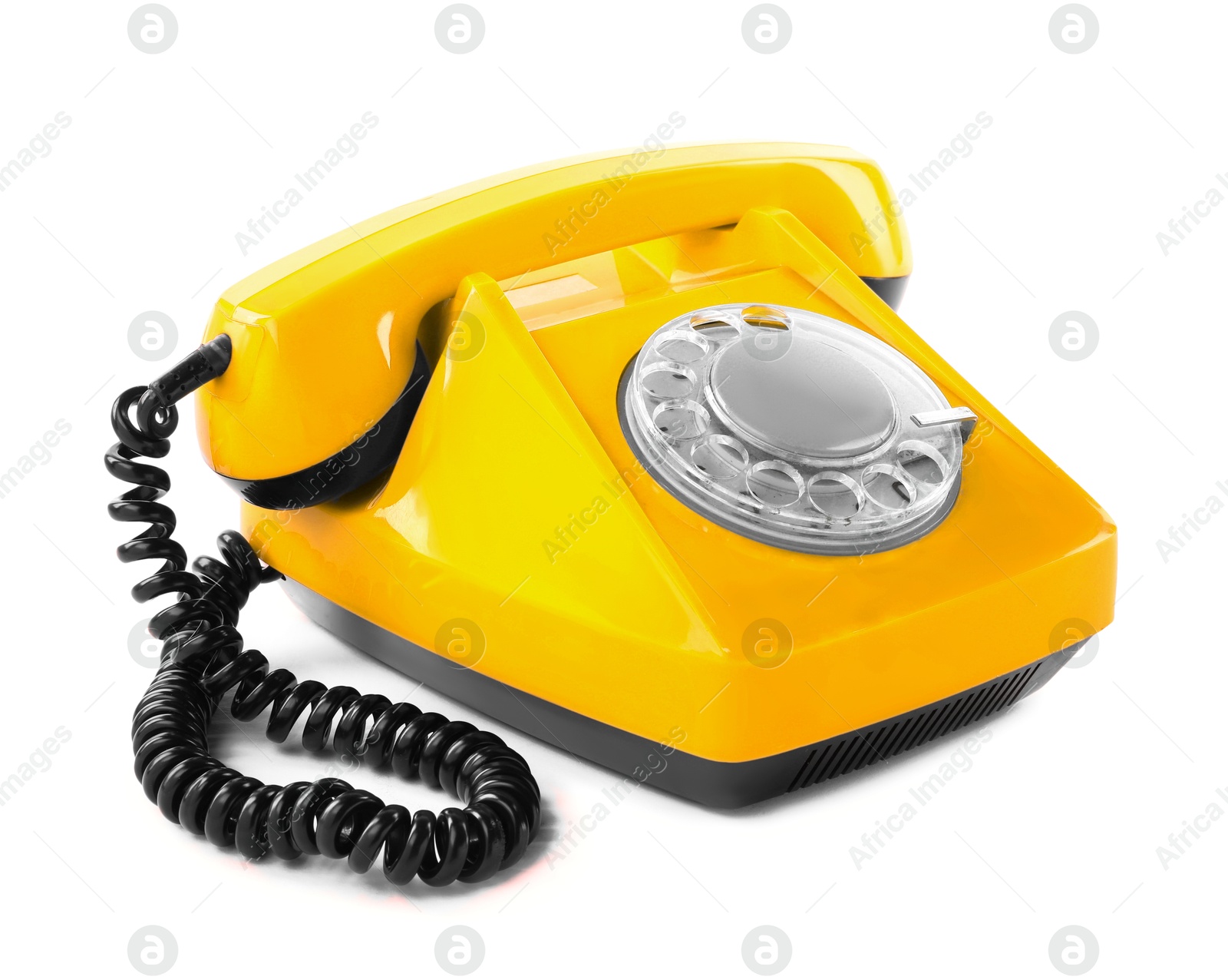 Image of Old yellow telephone with rotary dial isolated on white