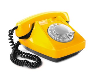 Image of Old yellow telephone with rotary dial isolated on white