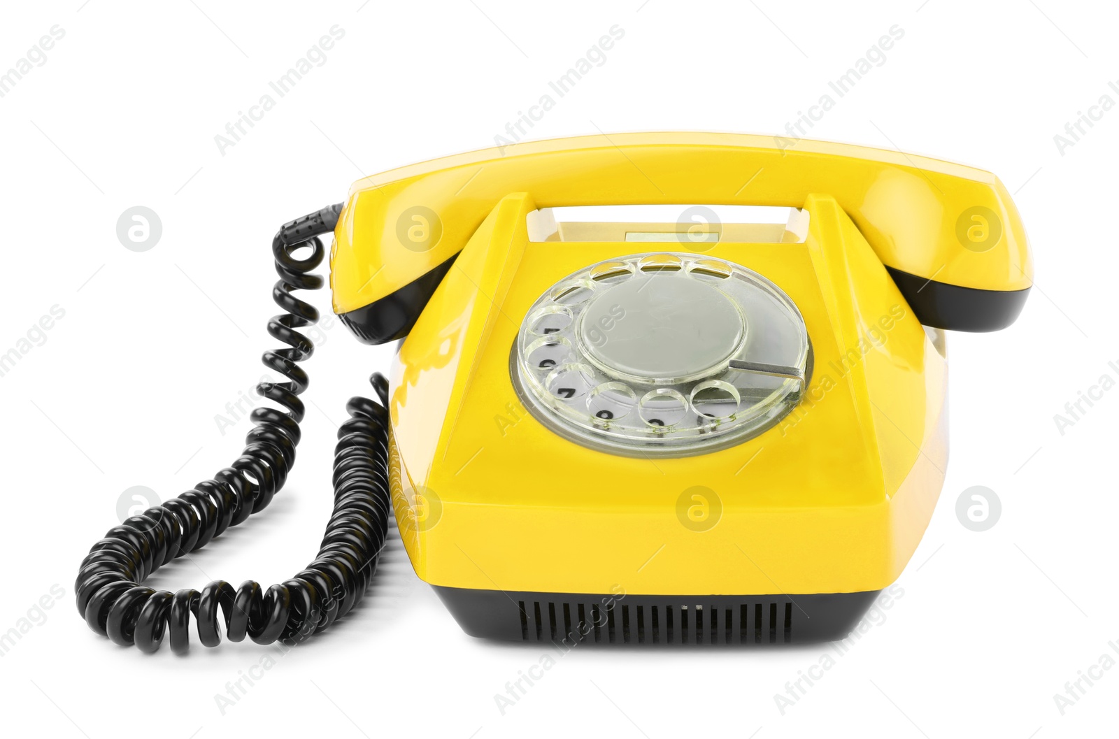 Image of Old yellow telephone with rotary dial isolated on white