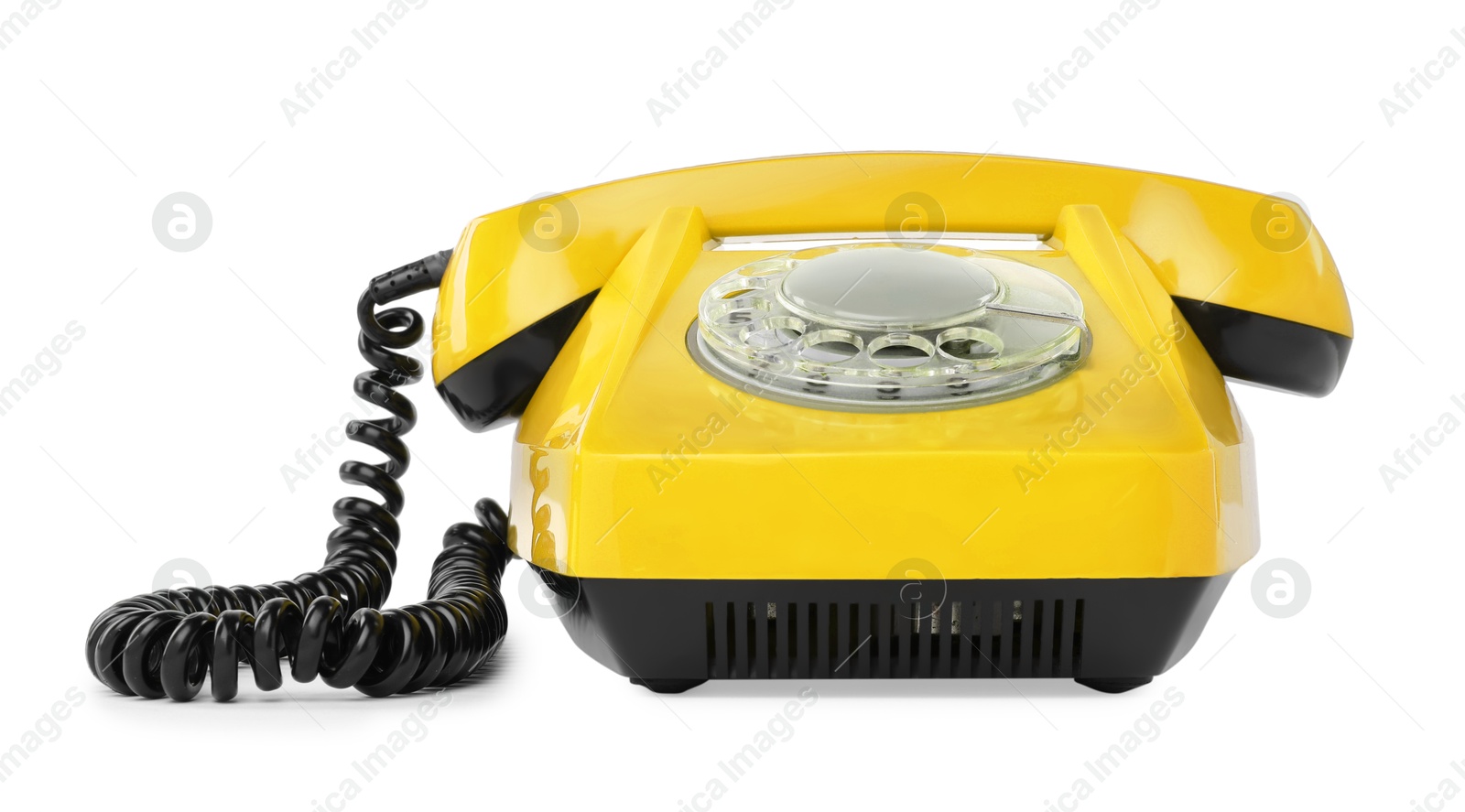 Image of Old yellow telephone with rotary dial isolated on white