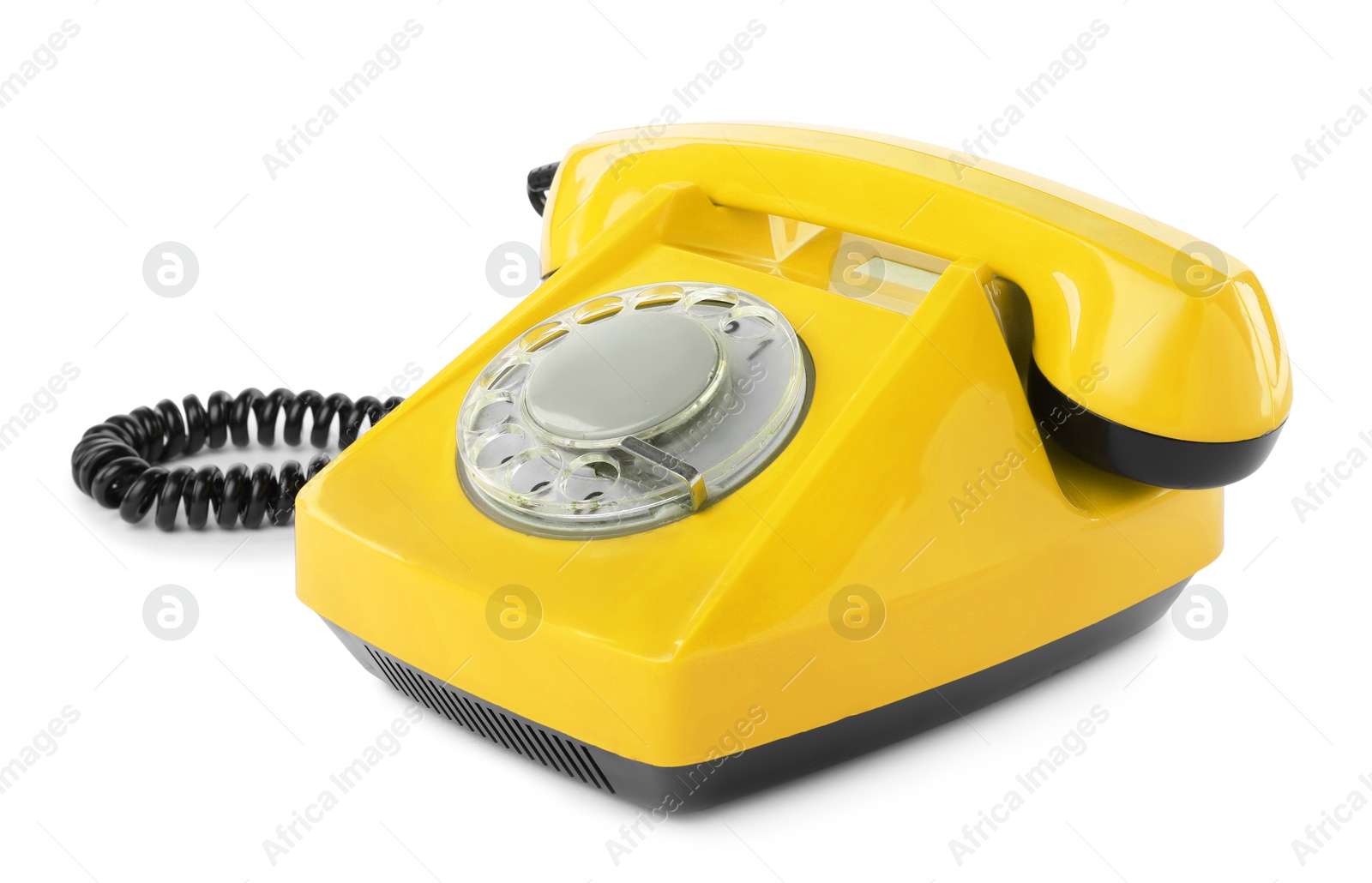 Image of Old yellow telephone with rotary dial isolated on white