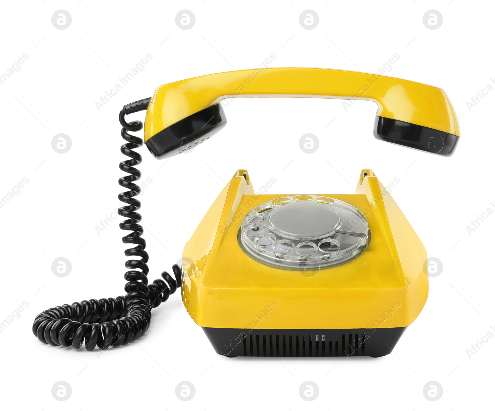 Image of Old yellow telephone with rotary dial isolated on white