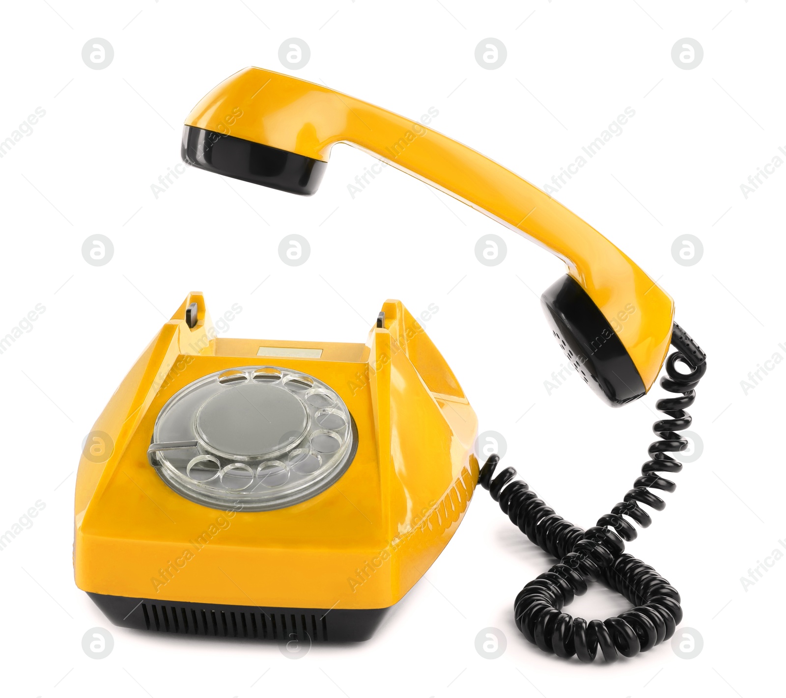 Image of Old yellow telephone with rotary dial isolated on white