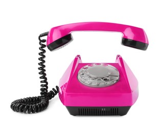 Image of Old magenta color telephone with rotary dial isolated on white