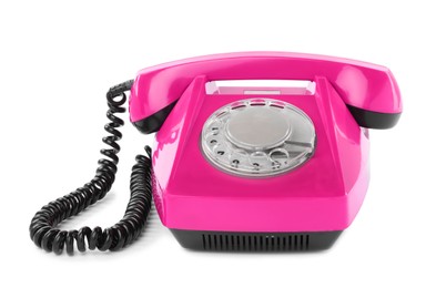 Image of Old magenta color telephone with rotary dial isolated on white