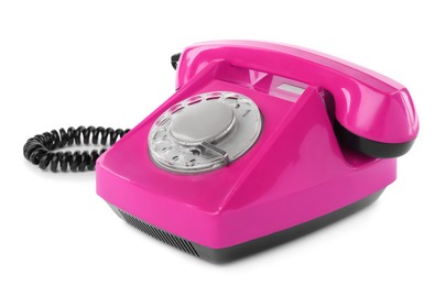 Image of Old magenta color telephone with rotary dial isolated on white