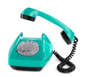 Image of Old turquoise color telephone with rotary dial isolated on white