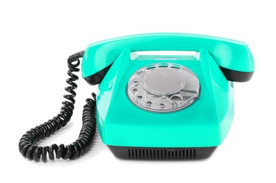 Image of Old turquoise color telephone with rotary dial isolated on white