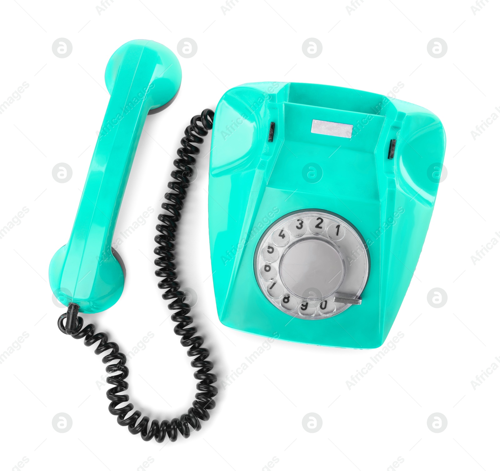 Image of Old turquoise color telephone with rotary dial isolated on white, top view