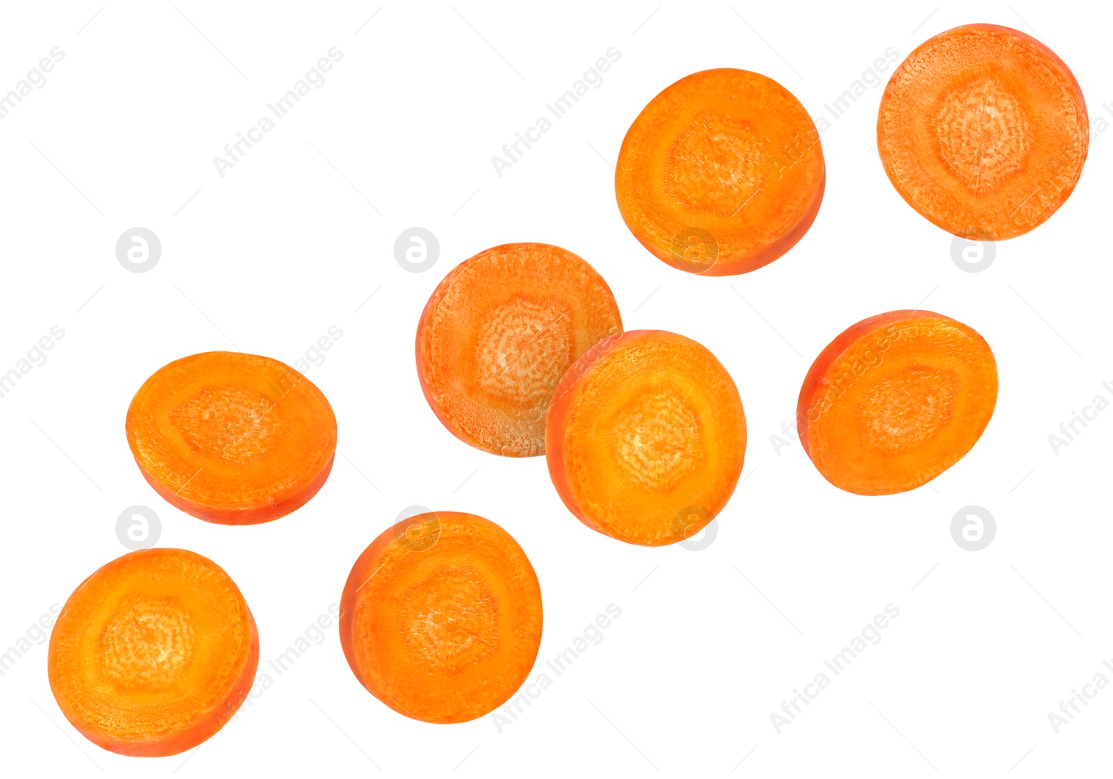 Image of Round carrot slices in air on white background