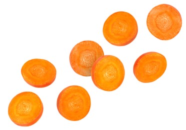 Image of Round carrot slices in air on white background