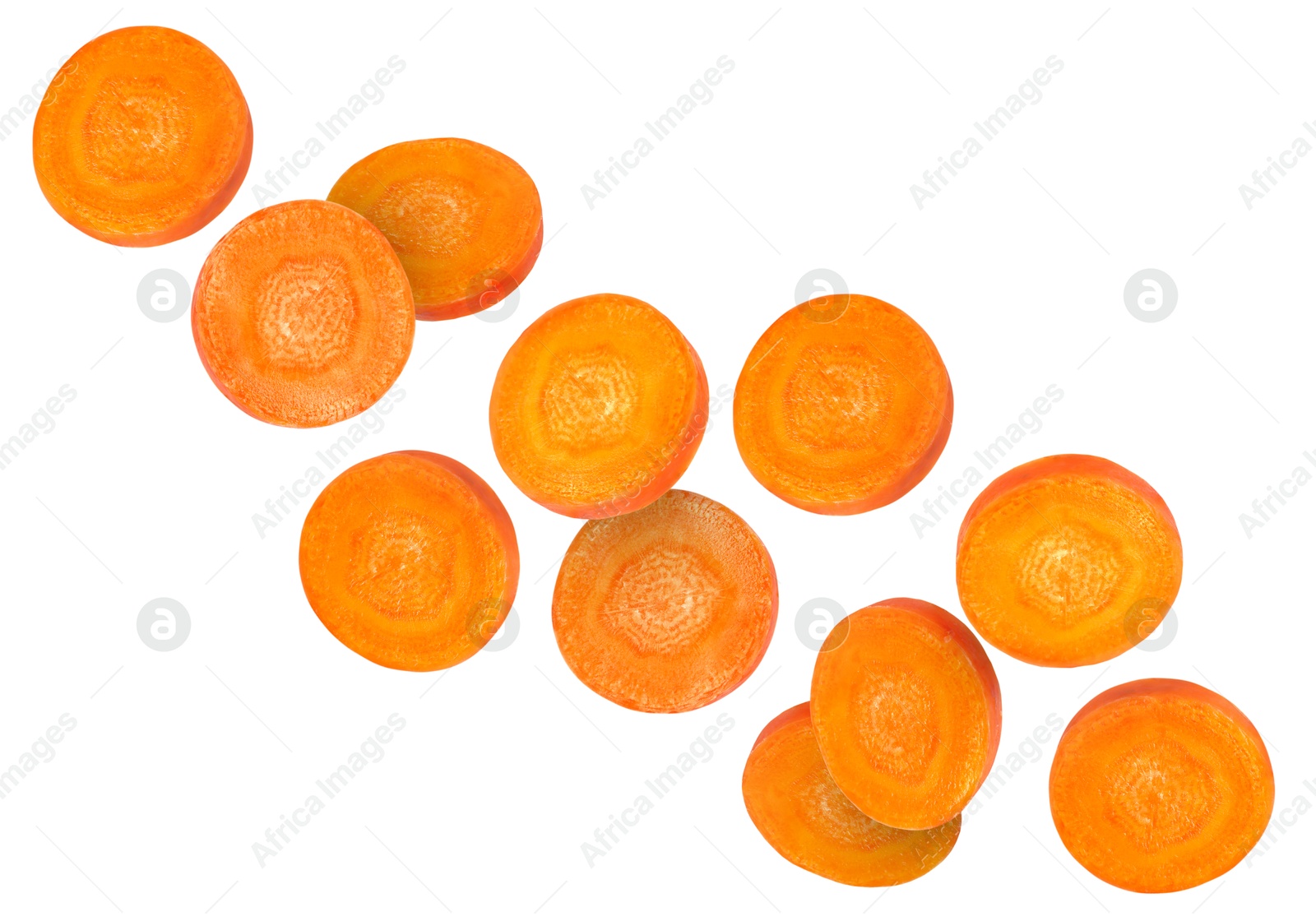 Image of Round carrot slices in air on white background