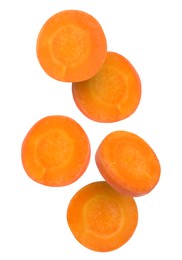 Image of Round carrot slices in air on white background