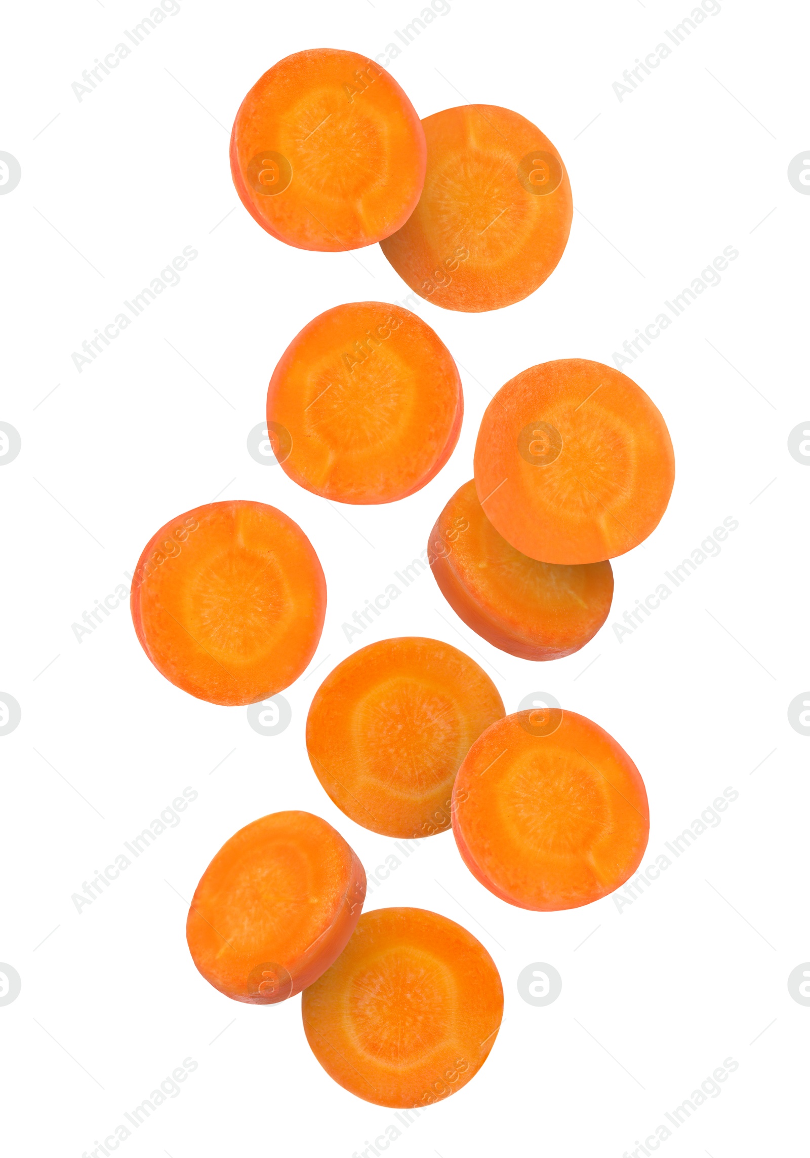 Image of Round carrot slices in air on white background